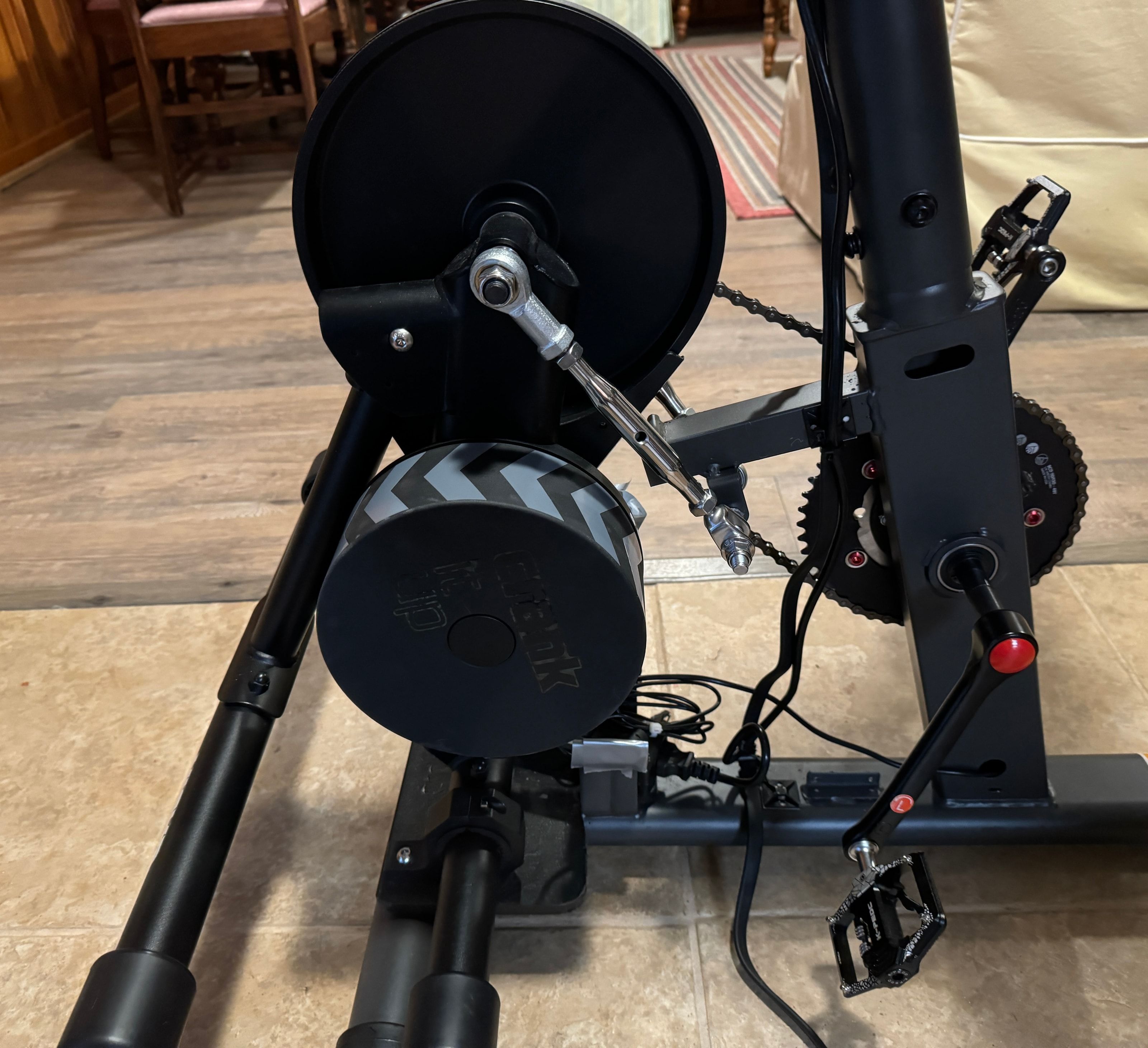 Wahoo KICKR CORE resistance unit mounted without its normal leg crossbars beneath a Schwinn frame